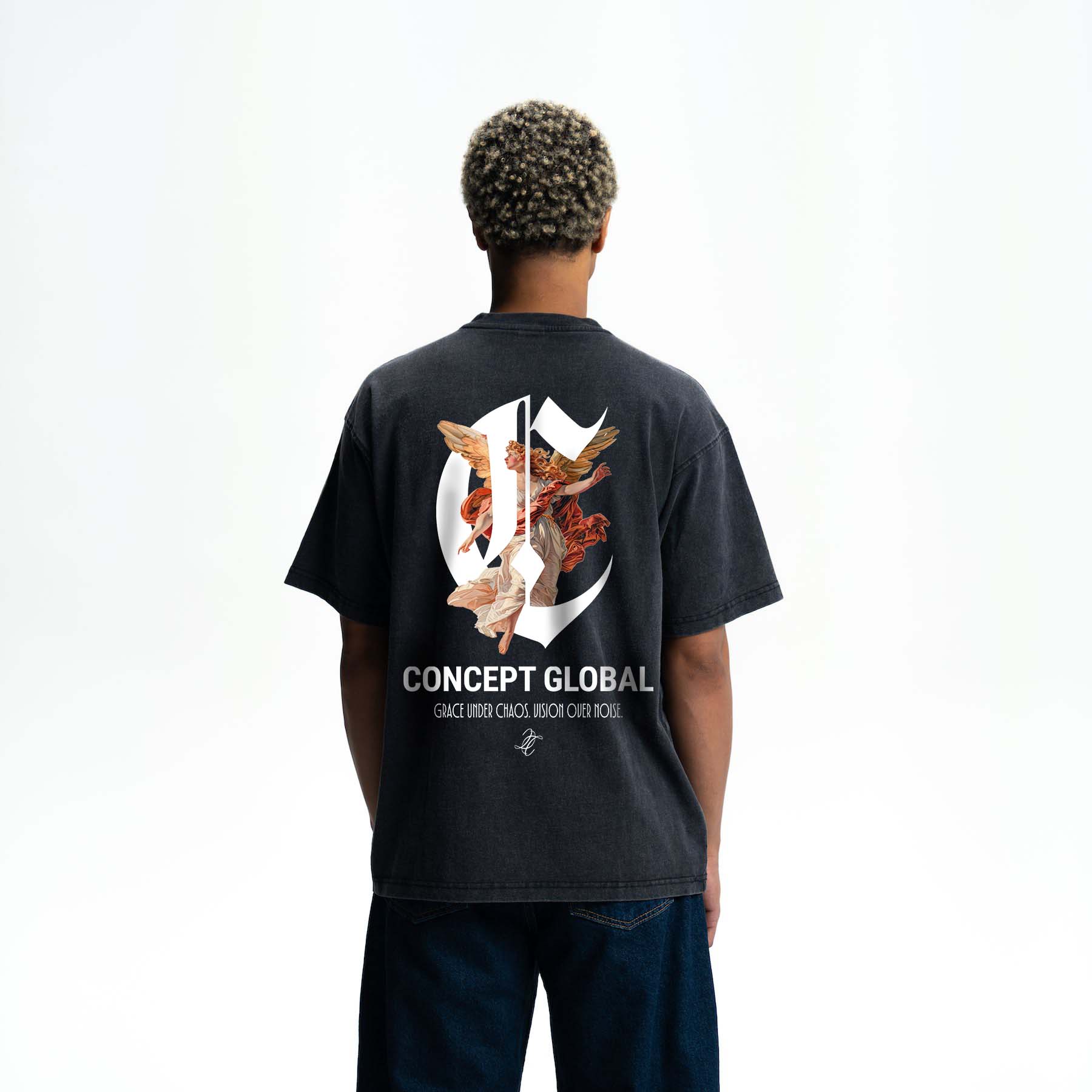 Person wearing a black t-shirt with a graphic design and Grace under chaos Vision over noise text on the back, on a white background.